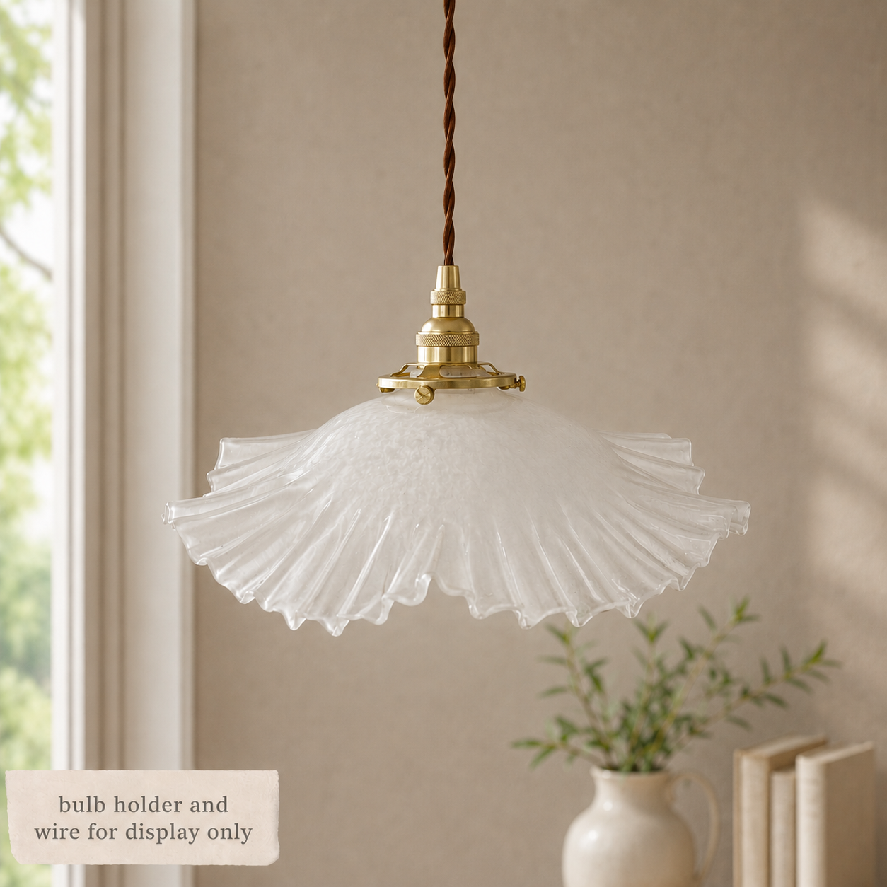 Vintage frosted glass light shade with brass gallery, suspended as a pendant light in a soft neutral interior. Decorative bulb holder and wire shown for display only.