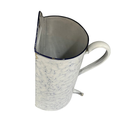 A vintage-style metal pot with a white marbled exterior, a dark blue rim, and a white handle, shown on a plain white background.