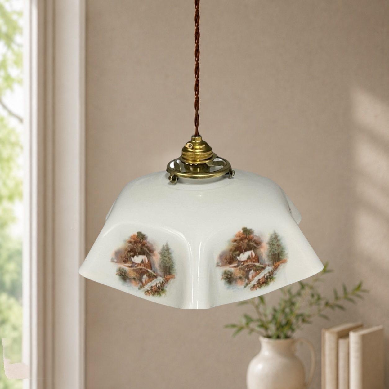 Decorative pendant light with painted design on a neutral background