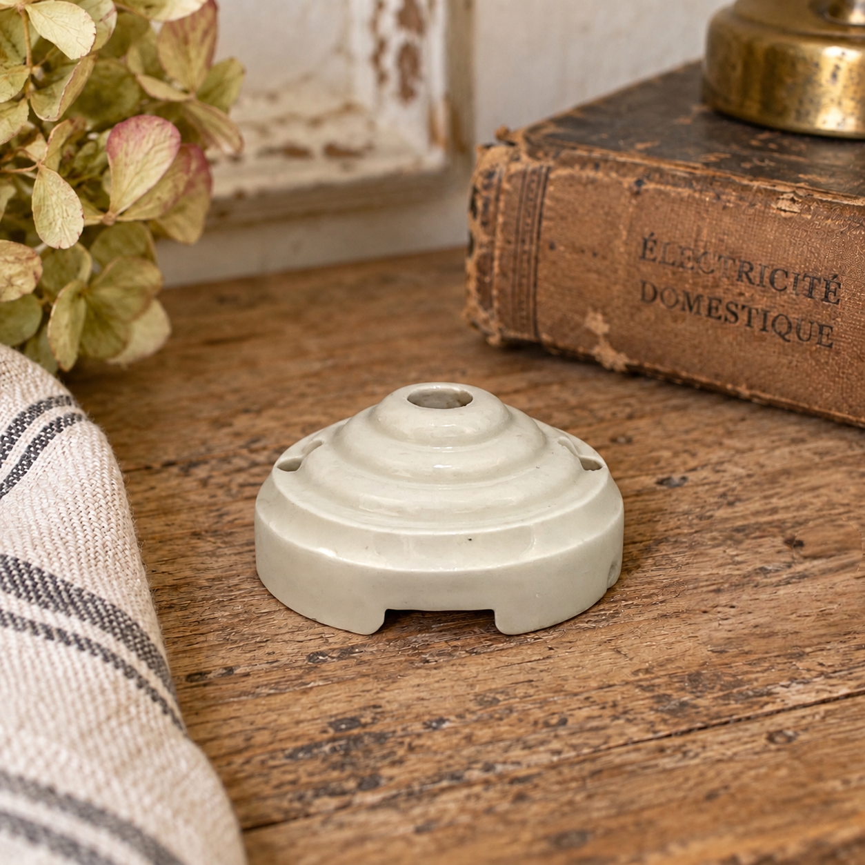 French vintage ceiling rose on a wooden table 