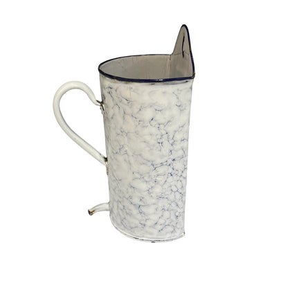 A vintage enamel pot with a white and blue marbled pattern, a white handle, and a small metal spout, shown on a plain white background.