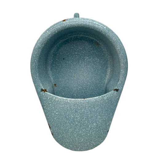 Blue speckled wall-mounted vintage French re purposed planter on a white background