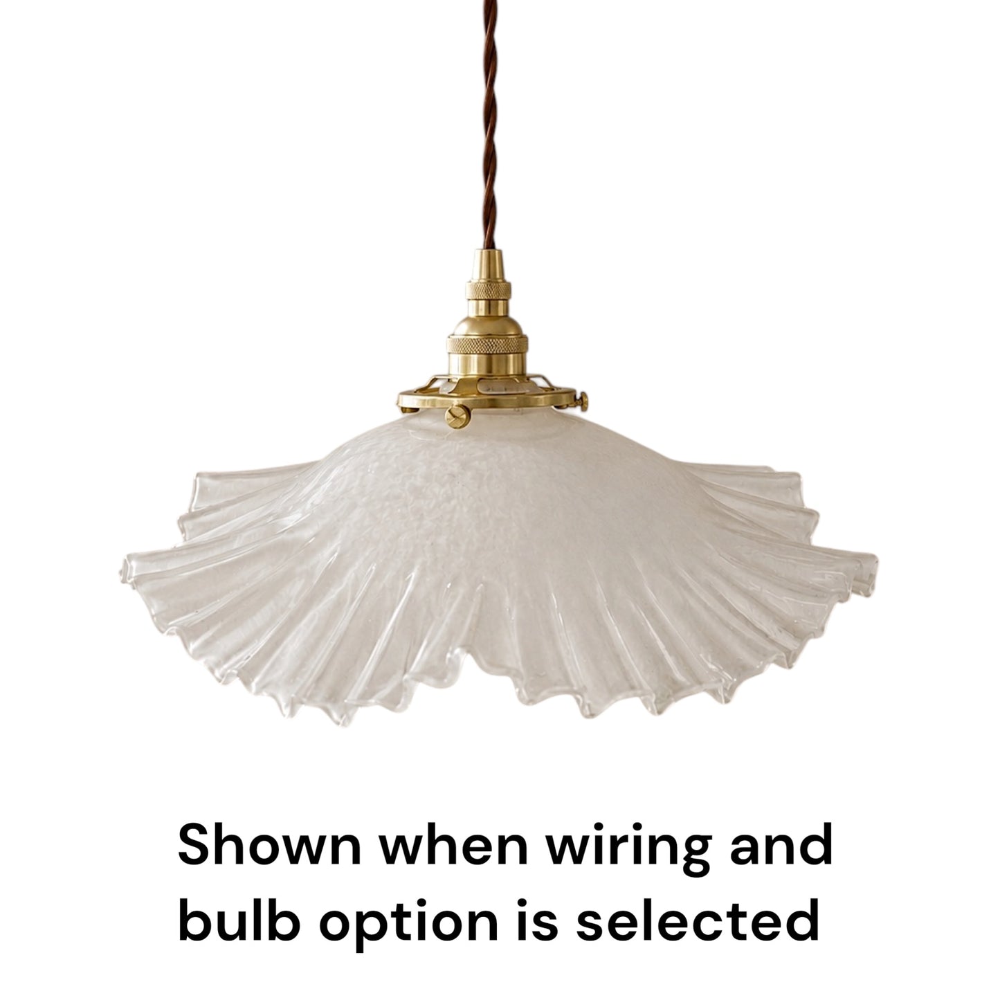 A vintage-style pendant light with a textured, pleated white glass shade and a brass metal fixture, suspended by a dark brown cord. Text at the bottom reads 'Shown when wiring and bulb option is selected'.
