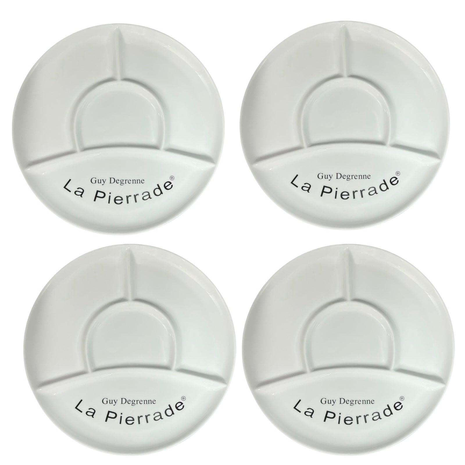 Four white plates with 'La Pierrade' branding on a white background