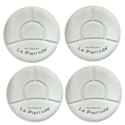 Four white plates with 'La Pierrade' branding on a white background