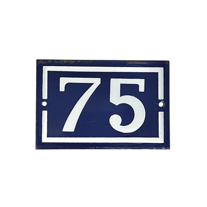 French vintage door number 75, blue with white numbers set on a white background 