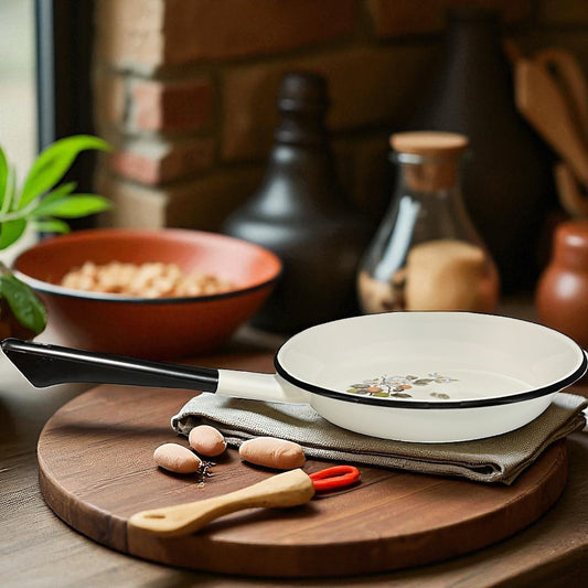 enamel dish with floral design on a wooden table with a rustic background