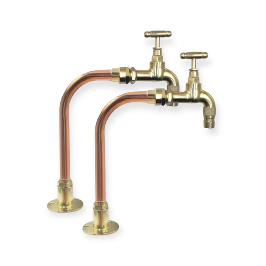 Brass and copper faucet on a white background