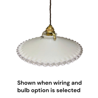 A vintage French milk glass pendant lampshade with a brass gallery holder and a brown twisted wire shown on a white background 