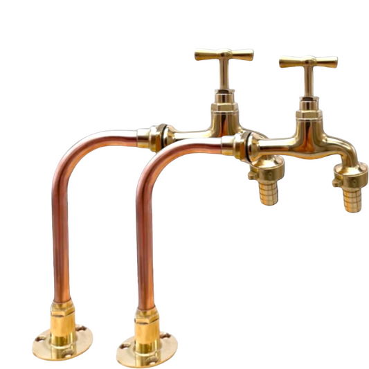 Gold and copper faucet on a white background