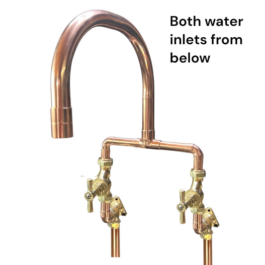 Copper kitchen faucet with dual water inlets on a white background