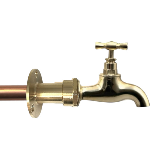 Brass faucet with copper pipe on a white background
