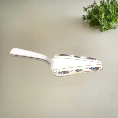 French fish slice or cake slice decorated with flowers made from porcelain