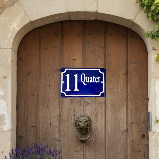 Blue and white sign with '11 Quater' on a wooden door with a lion knocker.