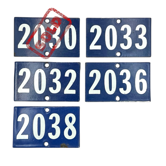 5 different blue enamel door numbers on a white background 