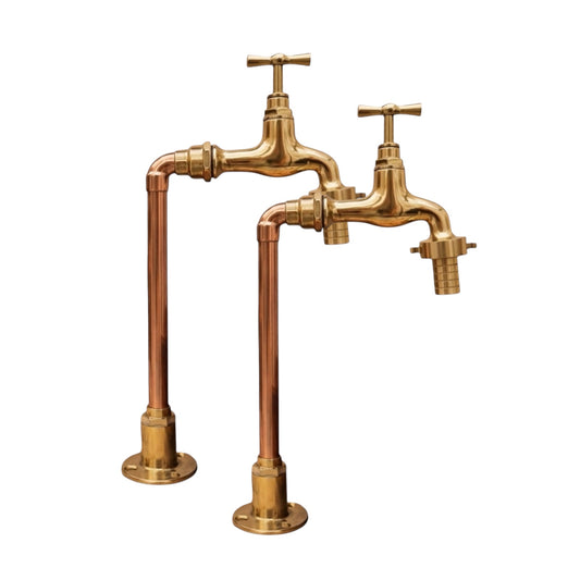 Pair of vintage-style brass faucets on  copper upstands ideal for a Belfast sink or farmhouse kitchen on a white background