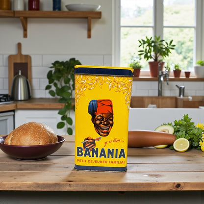 Vintage-style 'BANANIA' food canister on a kitchen counter with a yellow label featuring a face.