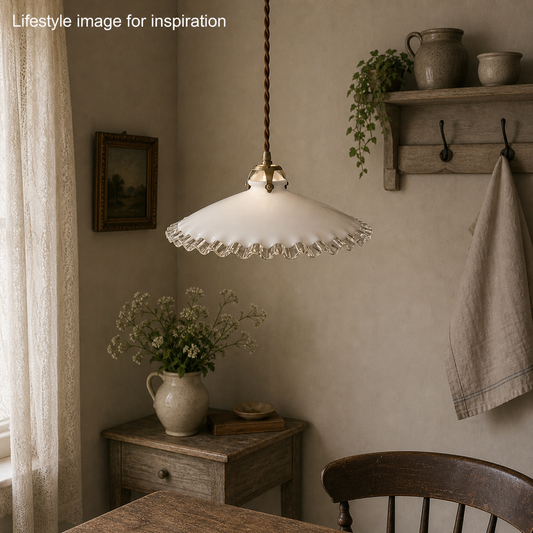 French vintage milk glass opaline lampshade with a clear trimmed frilly edge and a brass bulb holder ideal for a French country style set rustic farmhouse setting