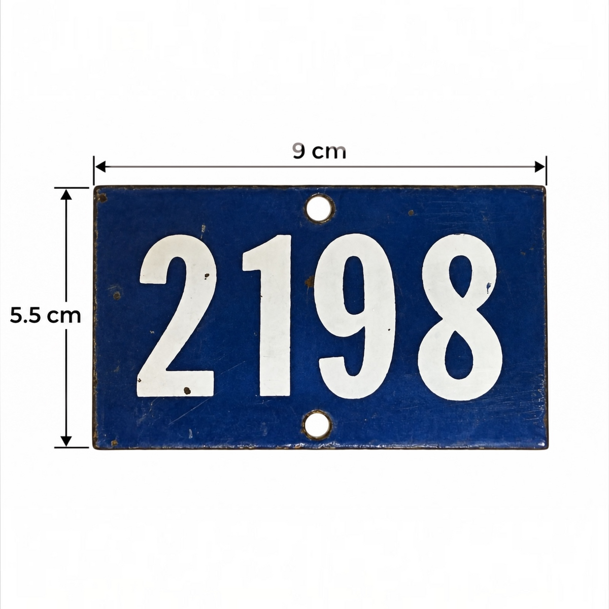 A blue rectangular metal house number plate with the white numbers 2198 and dimension markings showing 9 cm width and 5.5 cm height on a white background.