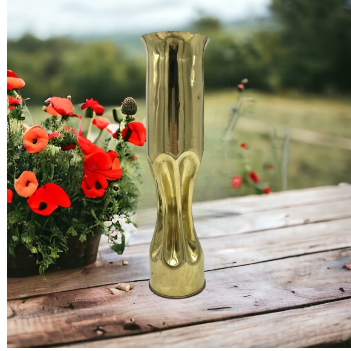 image French WW1 brass shell case on a table with poppies 