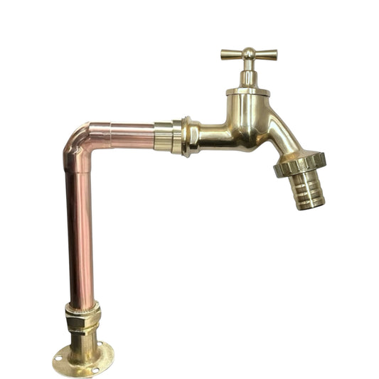 Brass and copper faucet taps on a white background