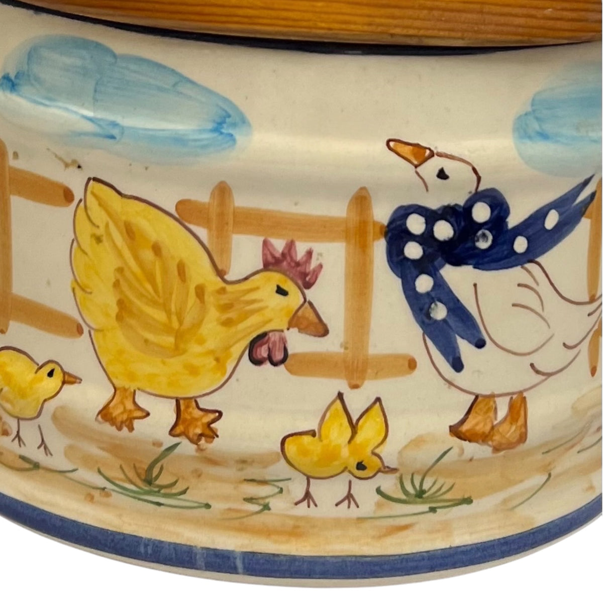 French ceramic salt pig on, farmyard decoration and a wooden lid on a white background Close up view