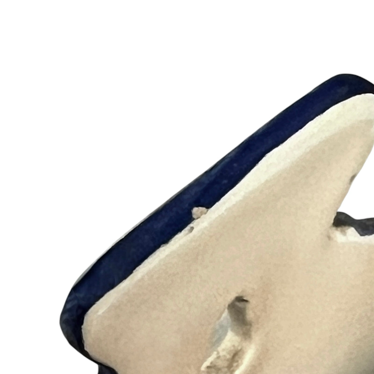 Close up of a French ceramic salt pig on, farmyard decoration and a wooden lid on a white background 