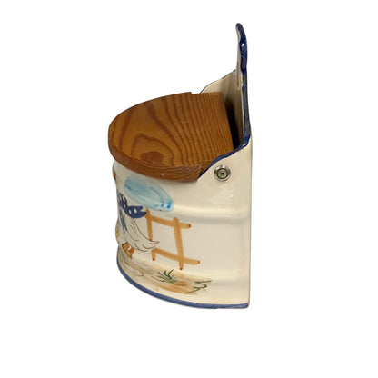 French ceramic salt pig on, farmyard decoration and a wooden lid on a white background Side view