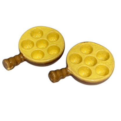 2 French vintage ceramic escargot serving plates, yellow inner with a brown exterior, each has 6 holes, shown on a plain white background 