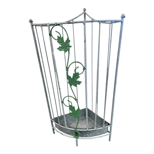 A vintage-style metal umbrella stand with a silver-toned frame and green ivy vine accents, set against a plain white background.