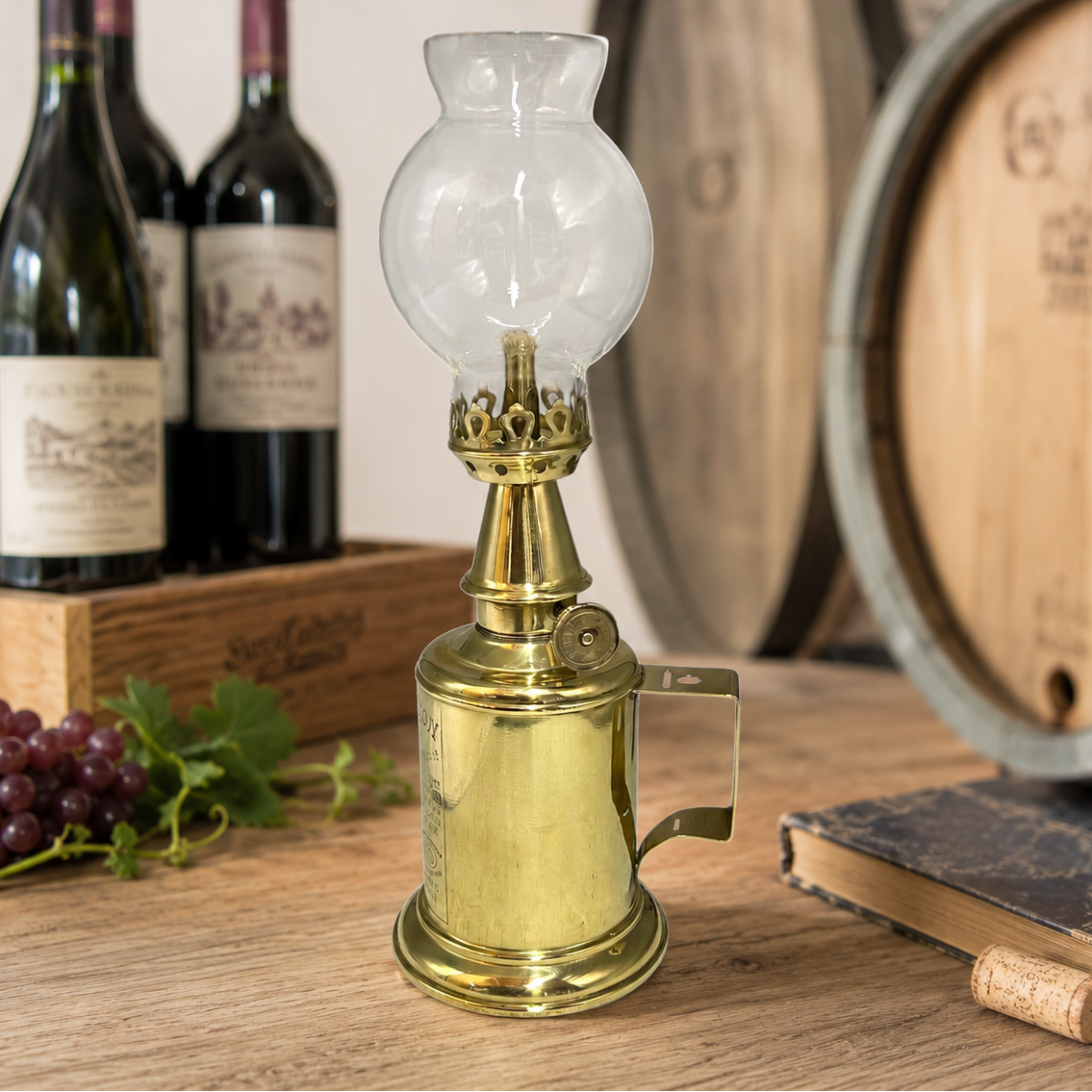 Brass oil lamp on a wooden table with wine bottles and barrels in the background 
