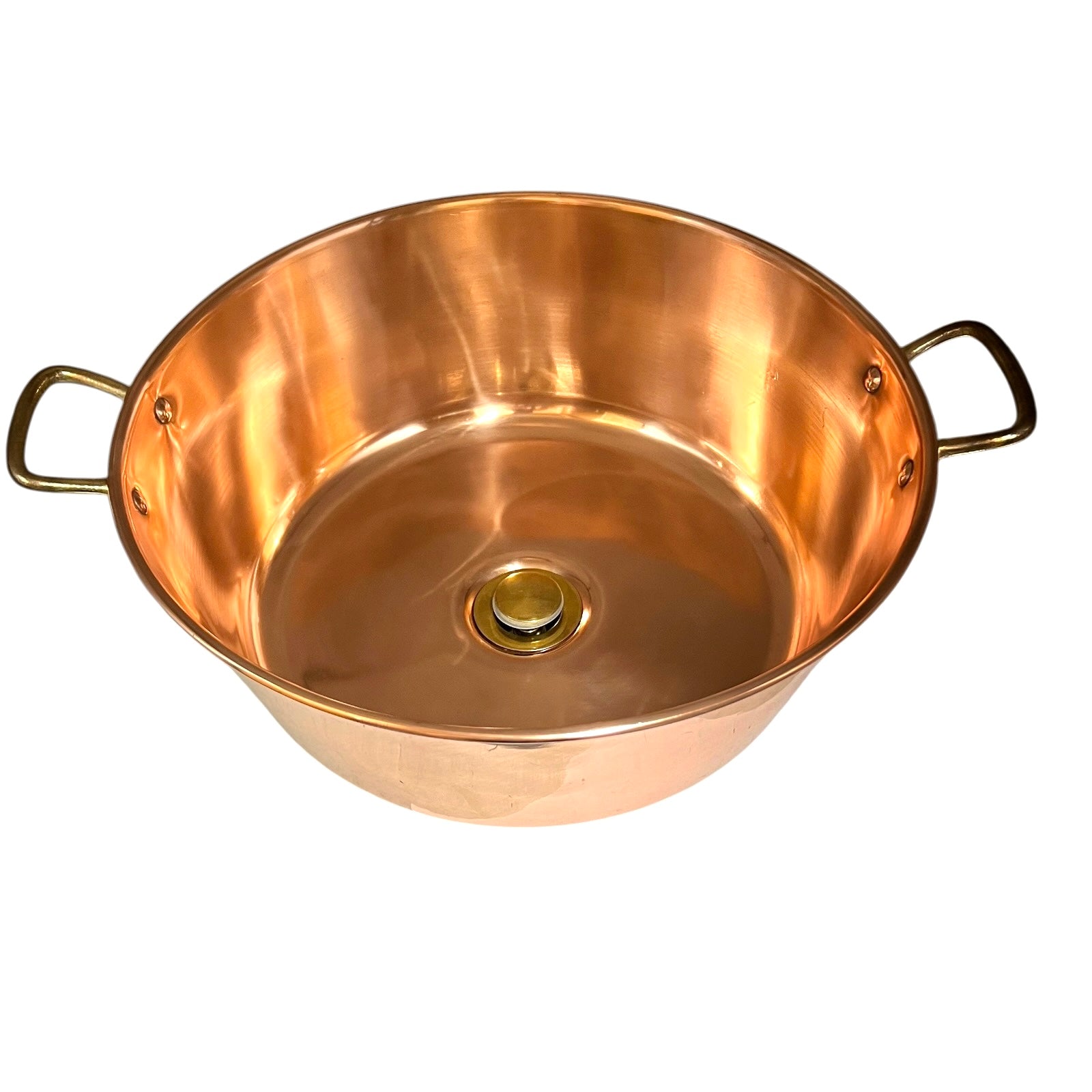 Copper up cycled cloakroom sink with brass handles and a brass drain on a white background 