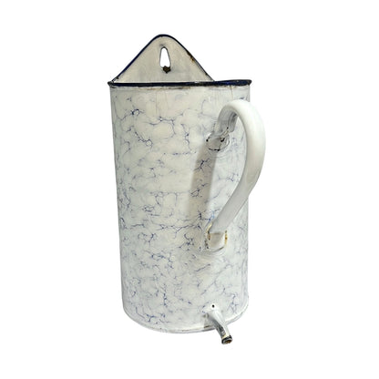 A vintage-style enamel planter with a white and blue marble pattern, featuring a white handle, a top hanging loop, and a small metal spout at the bottom.