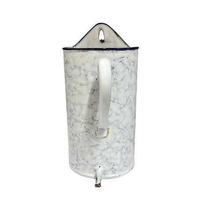 A vintage enamel pot with a white body, blue marble veining, a white handle, and a metal spout, shown on a plain white background.