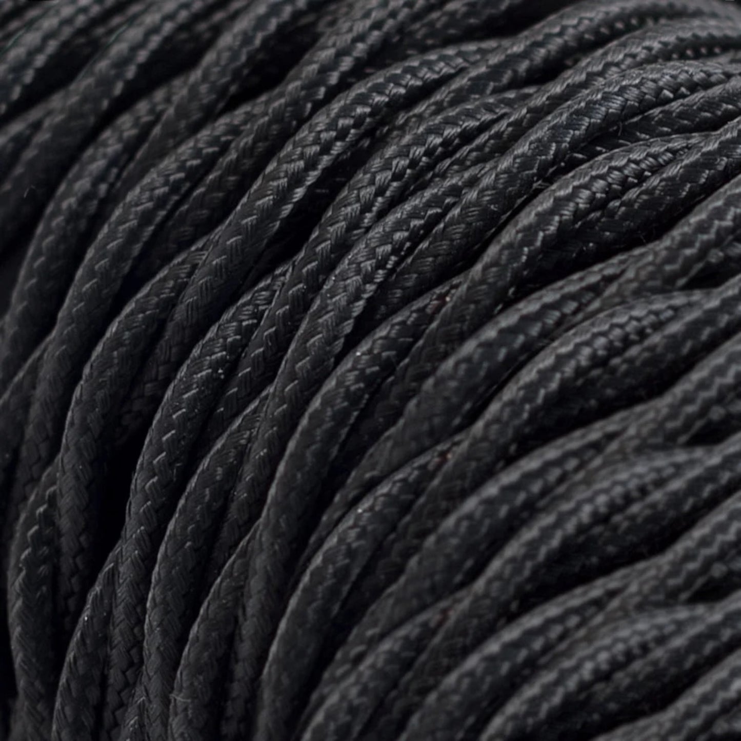 Close-up of black textured wire with a focus on texture and pattern.