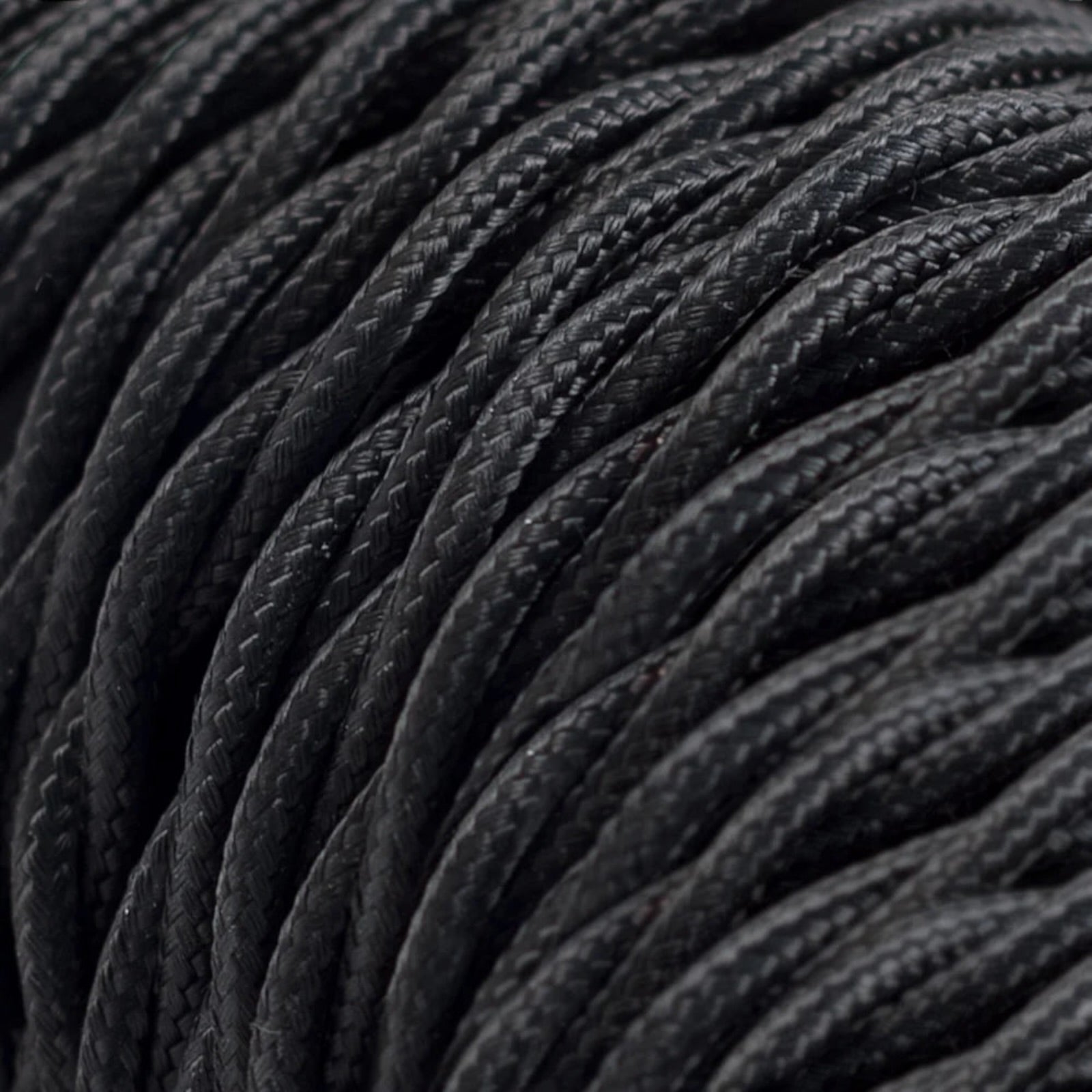 Close-up of black textured wire with a focus on texture and pattern.
