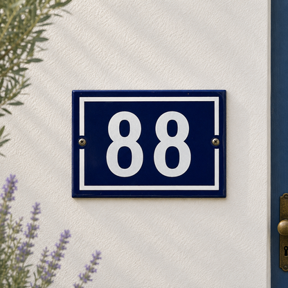 French vintage blue and white door number 88 on a whitewashed wall with lavender and a blue door in the background, ideal for a cottage or country style house 