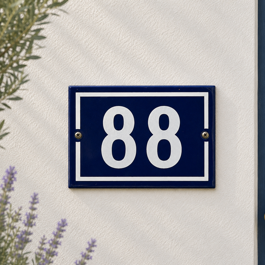 French vintage blue and white door number 88 on a whitewashed wall with lavender and a blue door in the background, ideal for a cottage or country style house 