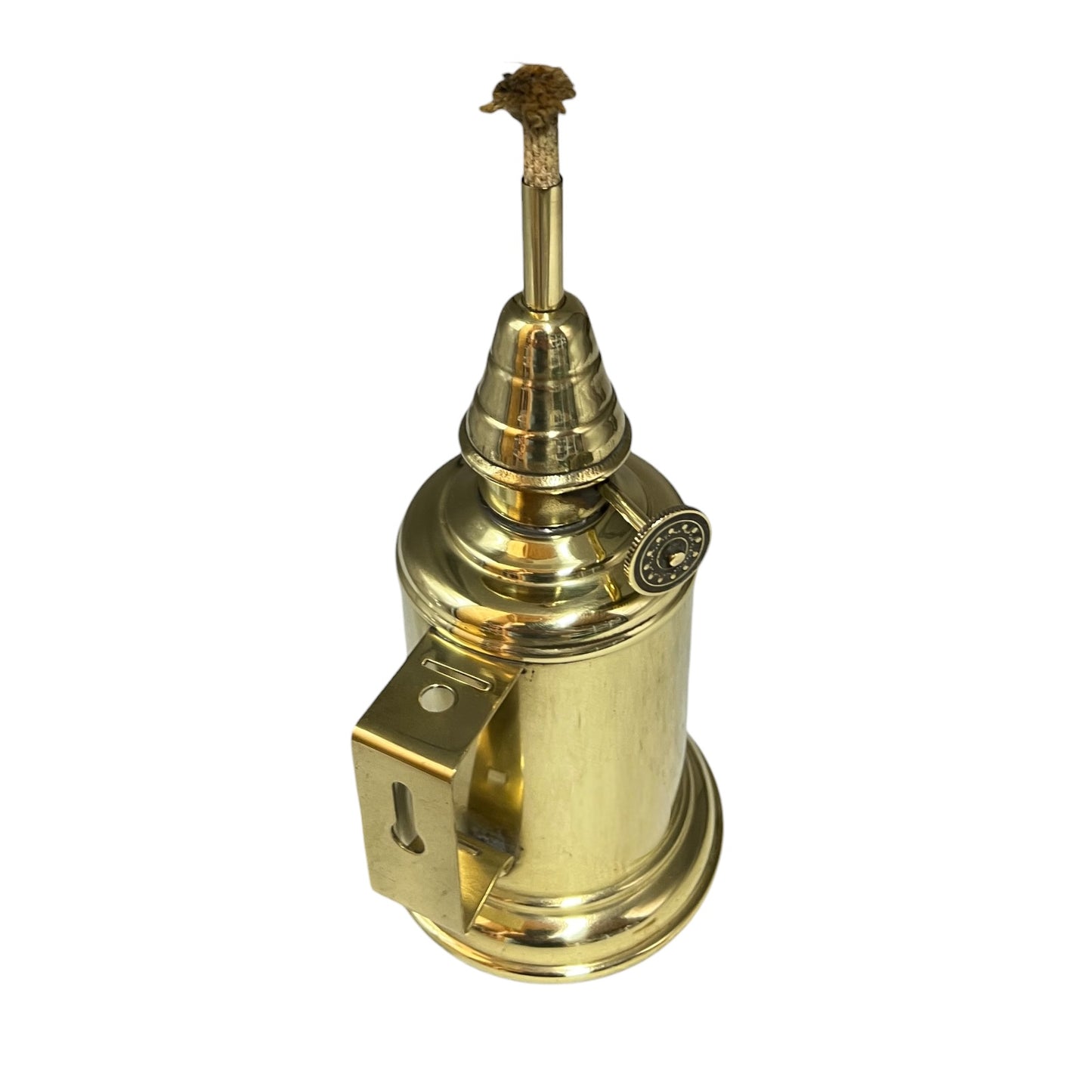 Brass oil lamp with wick on a white background