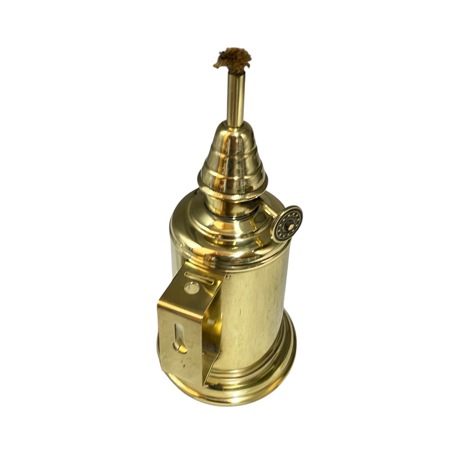 Brass oil lamp with wick on a white background
