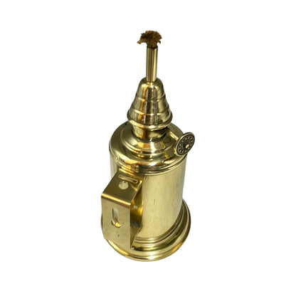 Brass oil lamp with wick on a white background