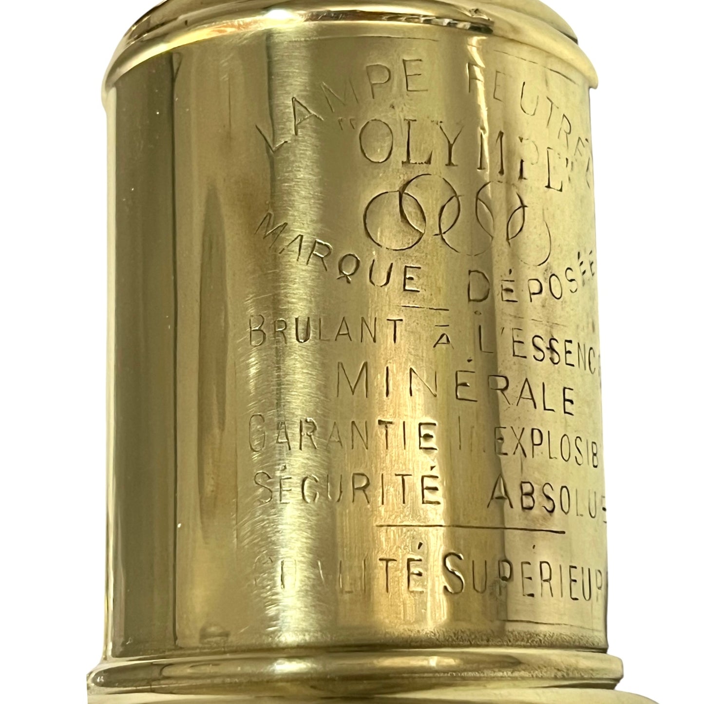 Brass lamp with engraved text on a white background