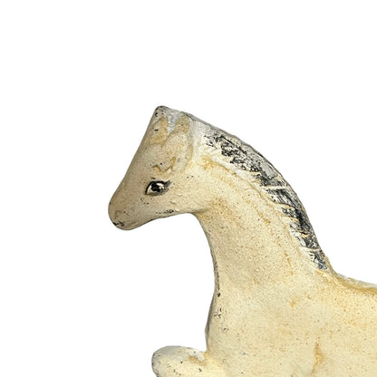 close up of a cast iron horse shaped toilet roll holder