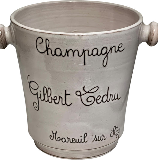 Ceramic champagne bucket with engraved text on a white background