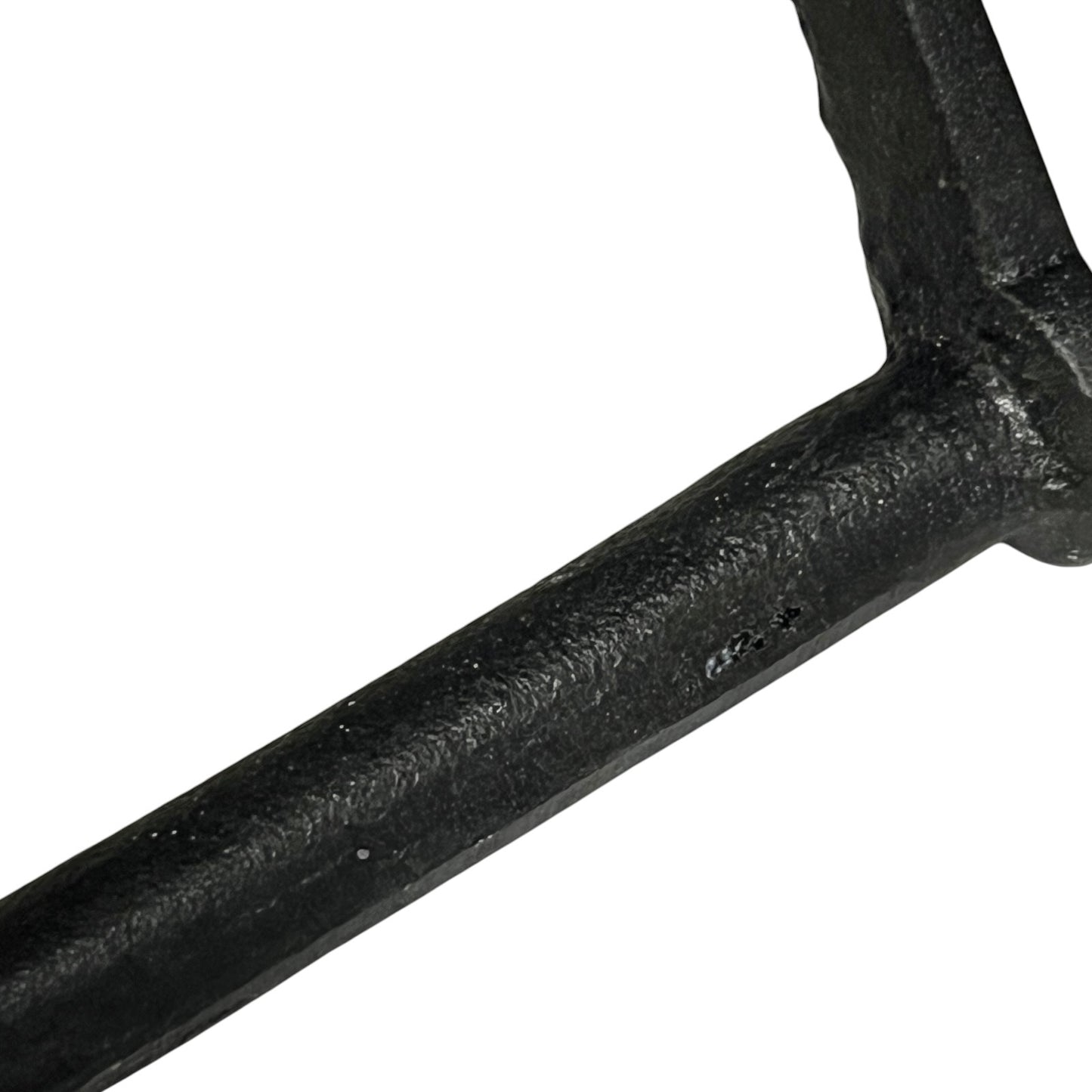 Close-up of a black metal bar on a white background