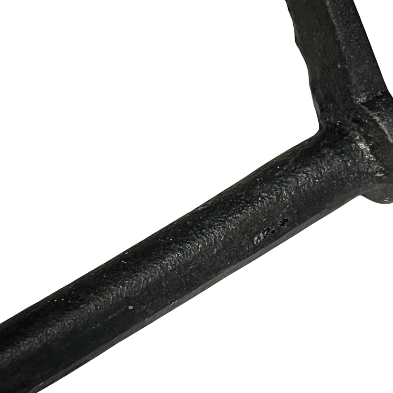 Close-up of a black metal bar on a white background