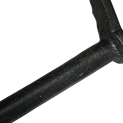 Close-up of a black metal bar on a white background