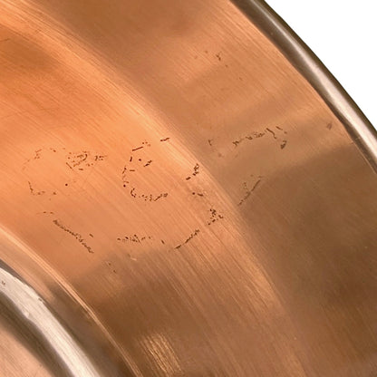 Close-up of a copper basin on a white background 