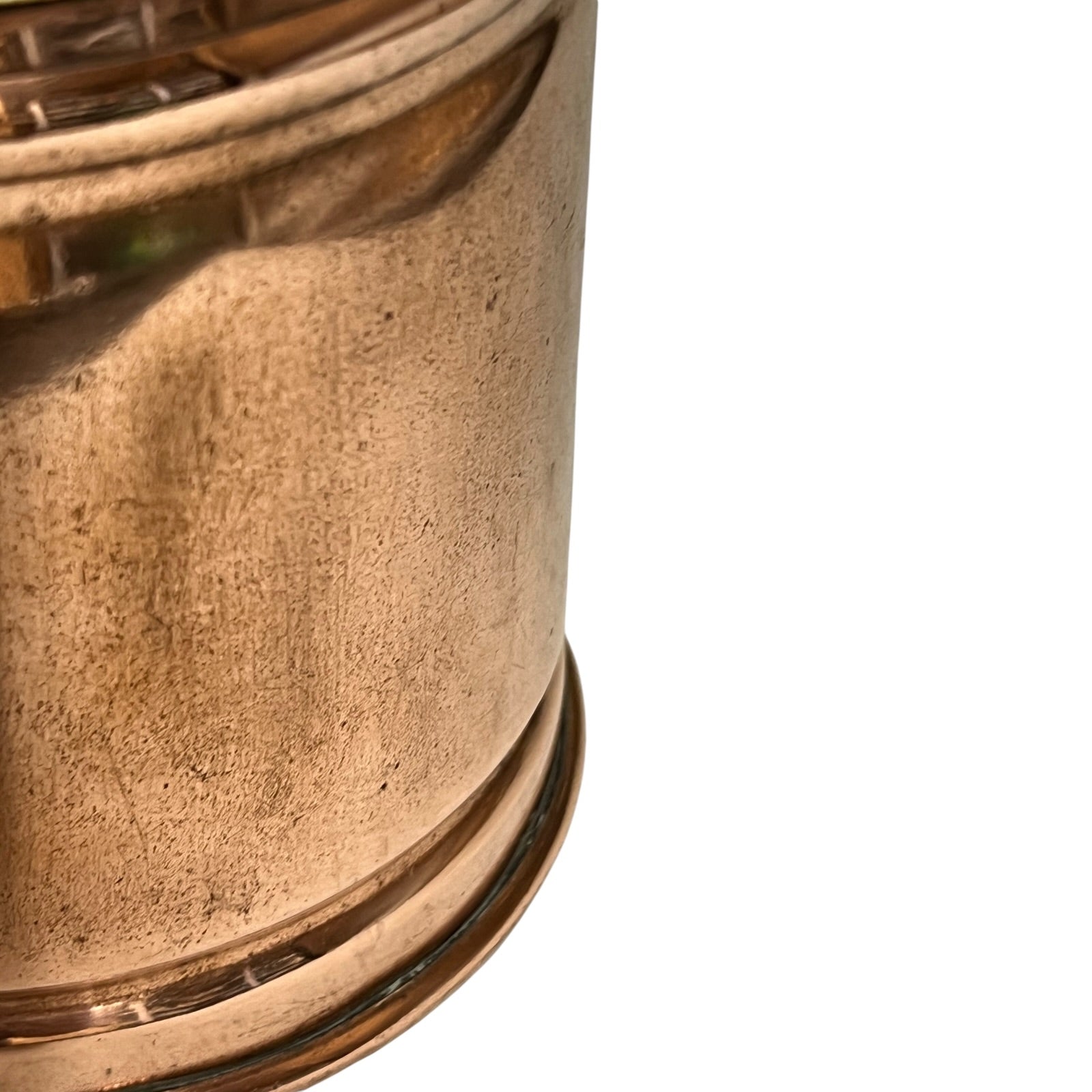 Close-up of a copper lamp with a textured surface on a white background