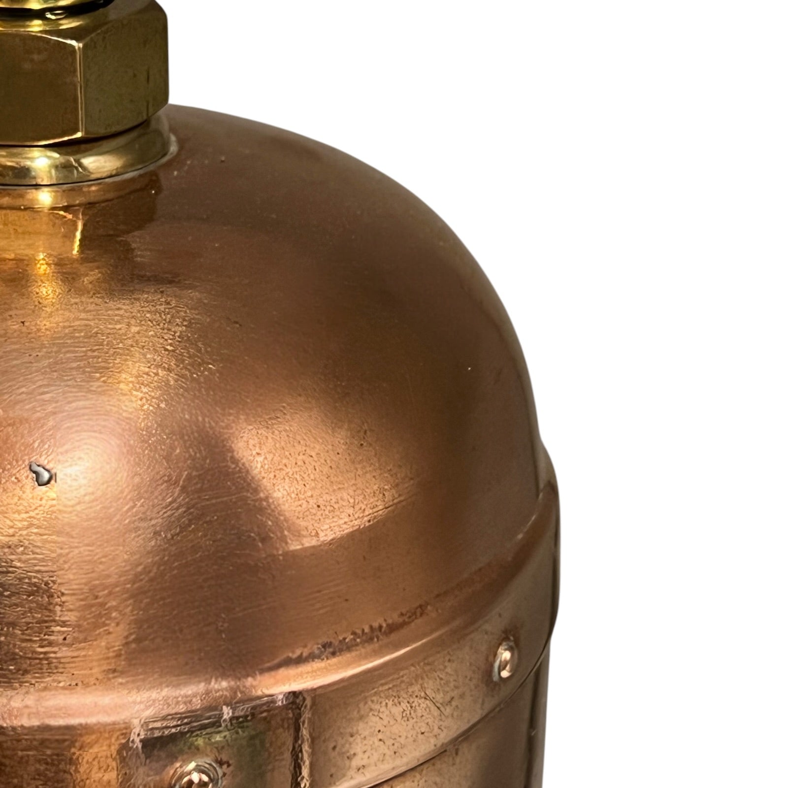 Close-up of a brass fitting on a white background